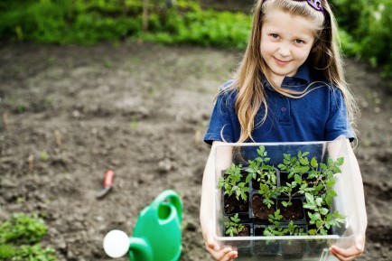 Girl holding plants