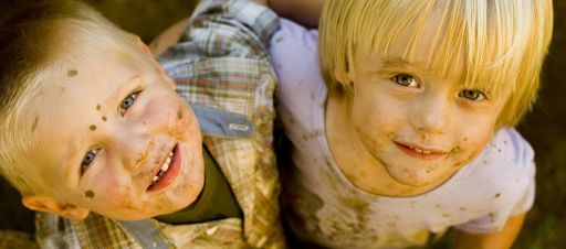 Two boys with dirt on their face