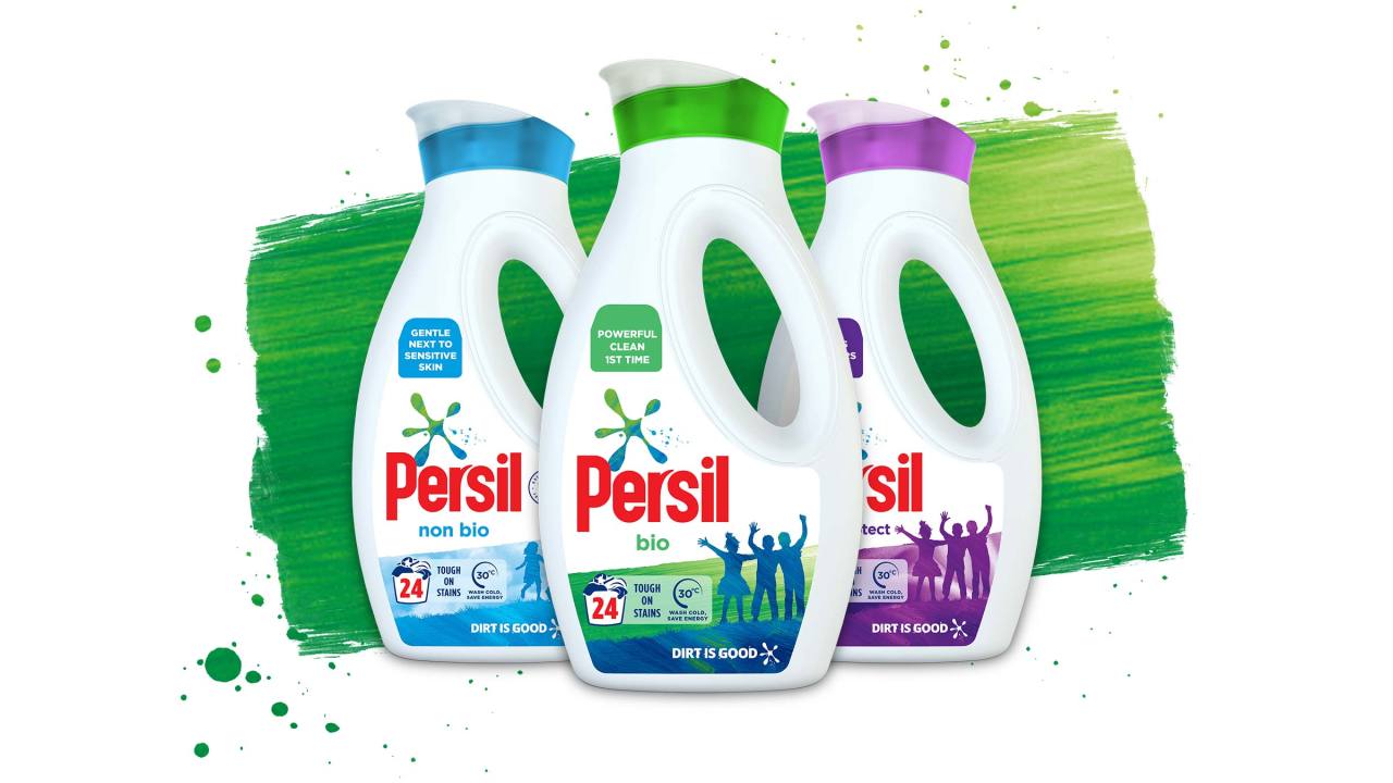 Three Persil liquid bottles against a green paint stroke background