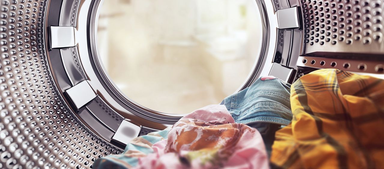 Clothes inside a washing machine drum.