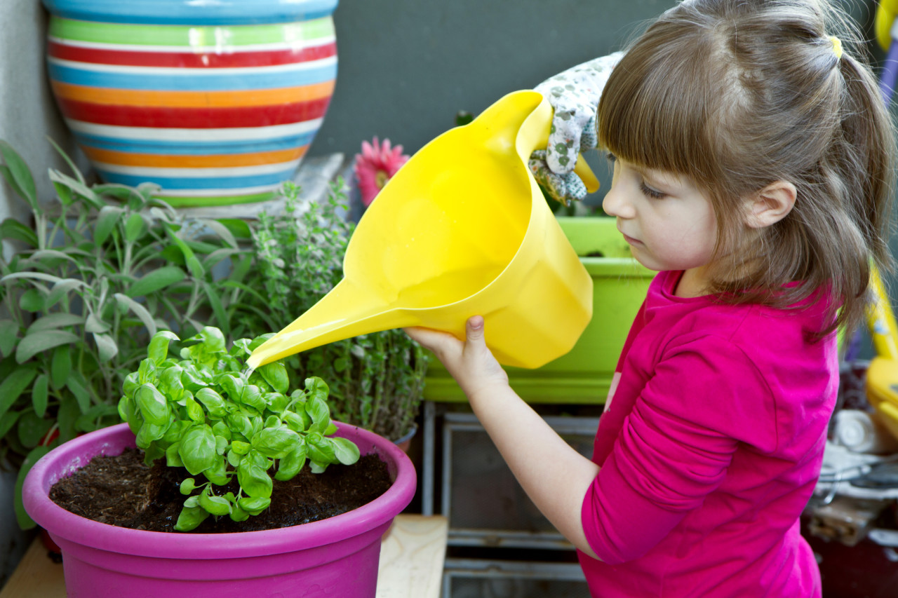 Girl with a watering can