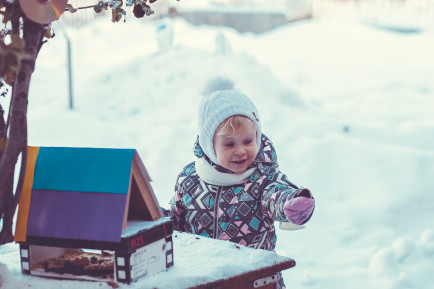 Young child playing in the snow