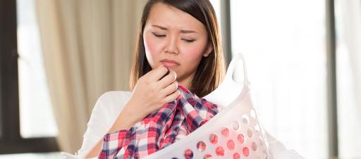 A woman unhappy with the smell of her laundry.