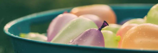 A close up image of colourful water balloons.