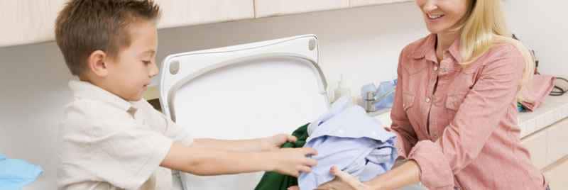 Mother and son doing laundry together