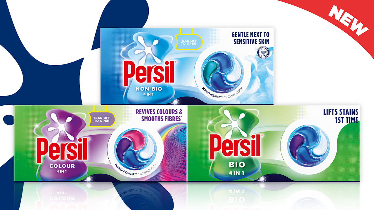 Three Persil capsules boxes against persil logo splat