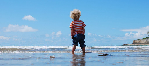Child playing in the sea