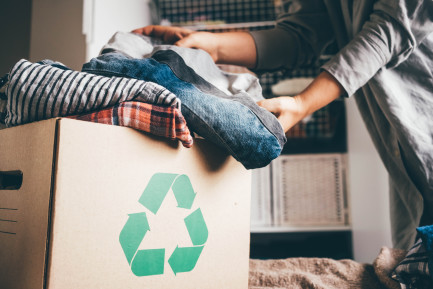 Recycling box with clothes inside