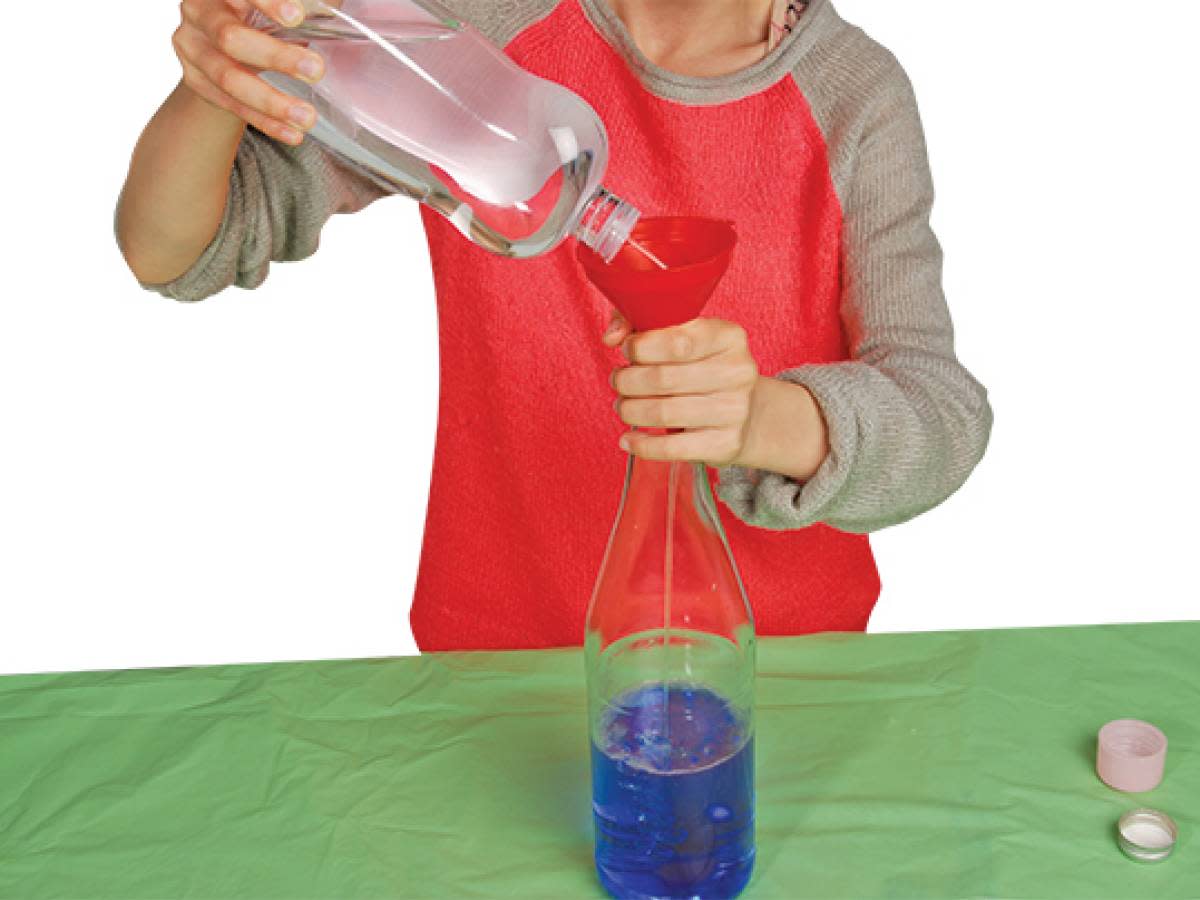 Person using funnel for bottle