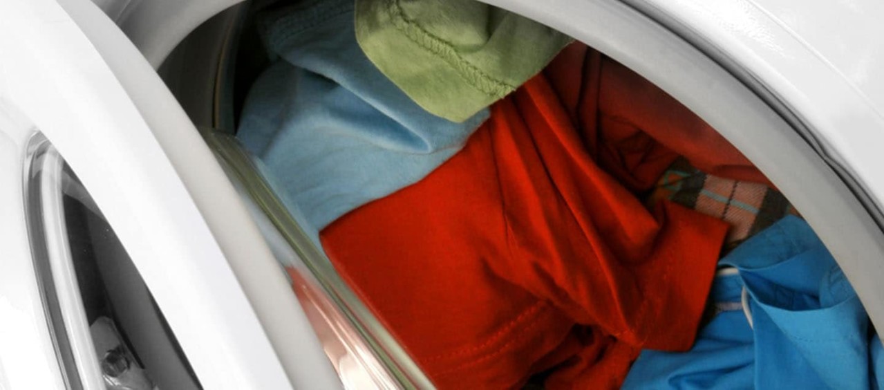 Clothes inside a washing machine drum.