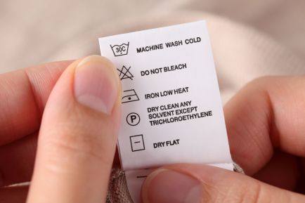 A clothing label showing laundry symbols with their instructions.