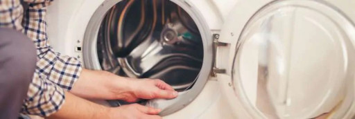 Person looking inside a washing machine