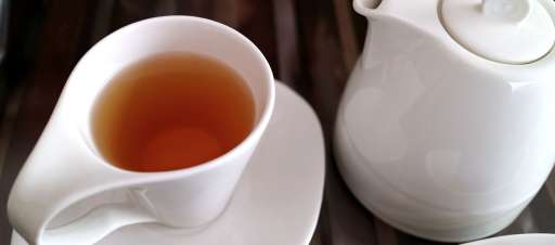 A cup and pot of tea.