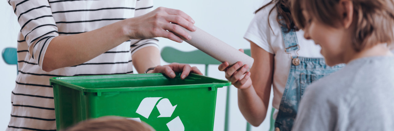 Parents and children recycling